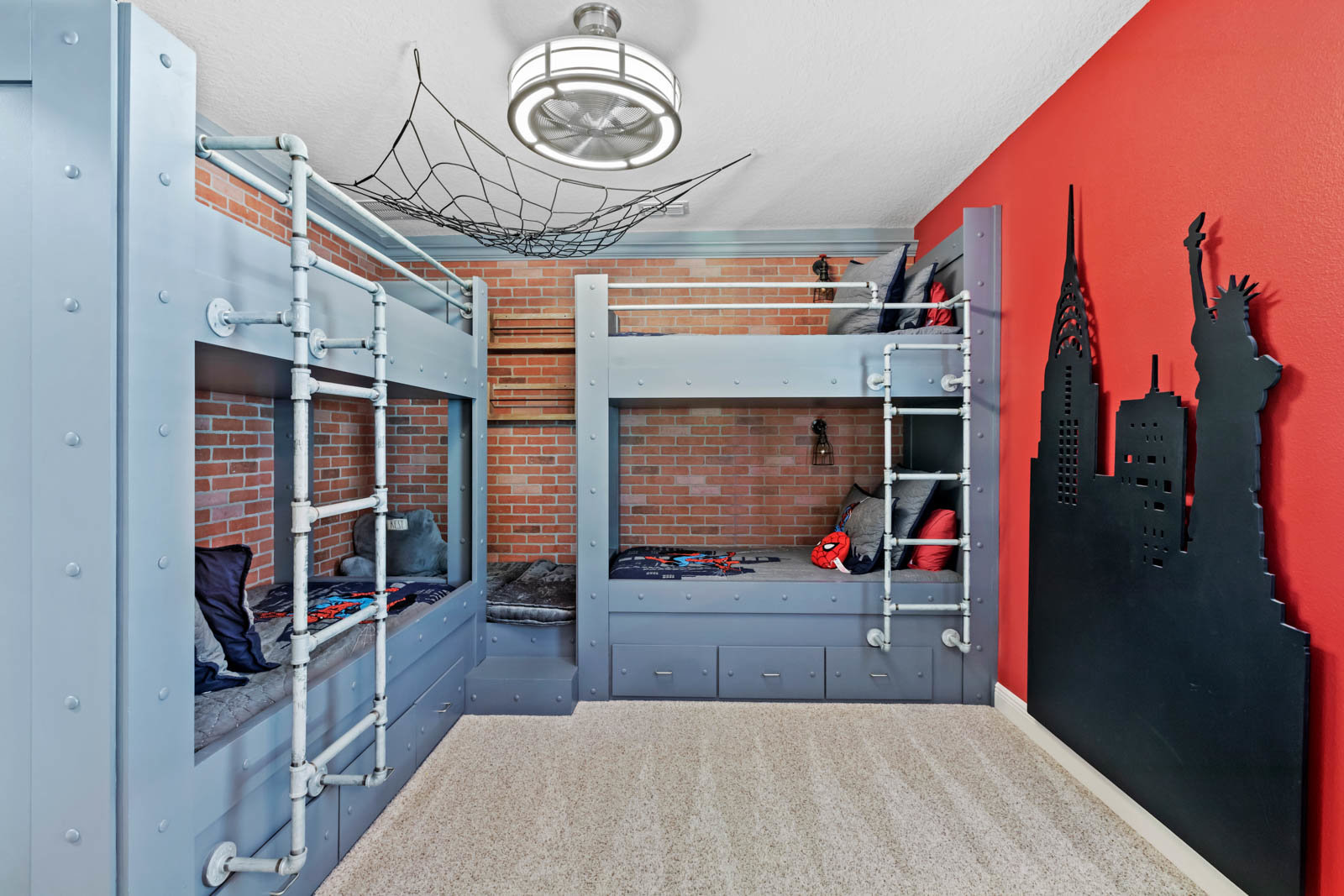 spiderman bedroom with red wall and bunk beds